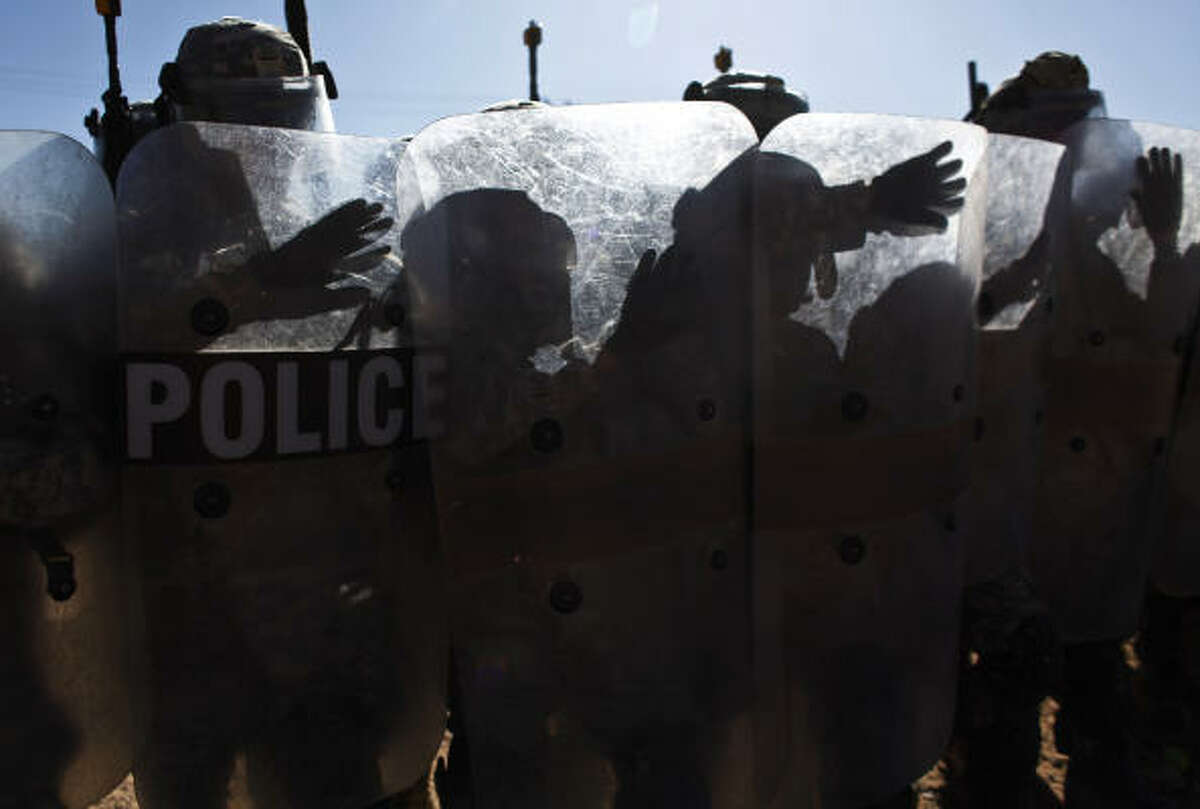 Members of the 72nd Infantry Brigade Combat Team practice riot control at Camp McGregor, NM, on Oct. 21, 2009.