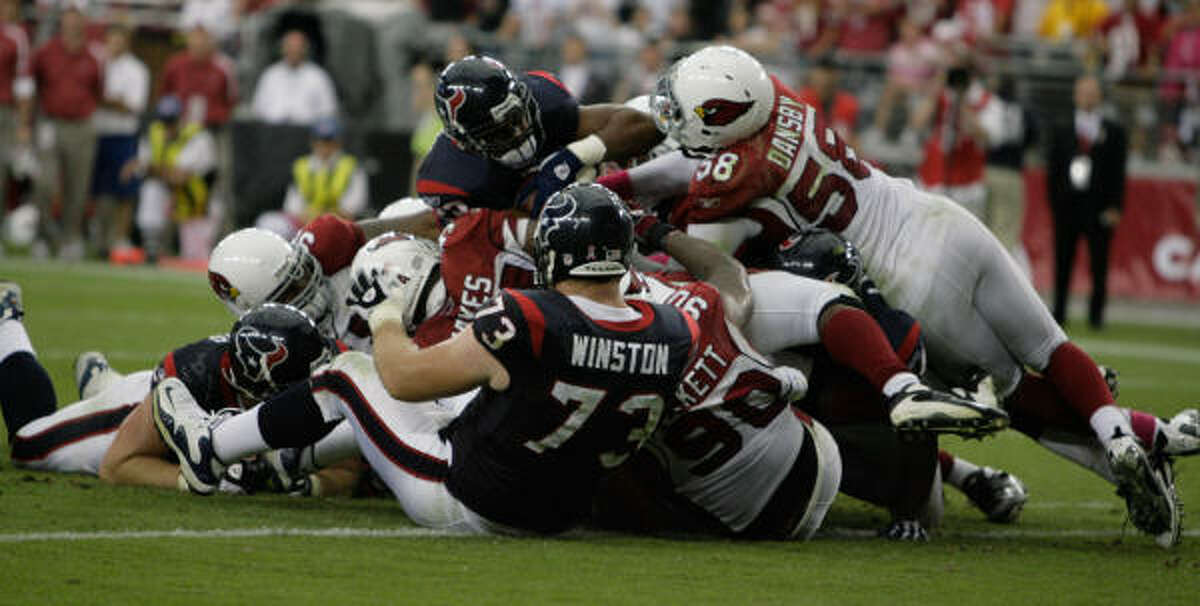 Texans running back Chris Brown is stopped short of the goal line by the Arizona defense with less than a minute remaining.