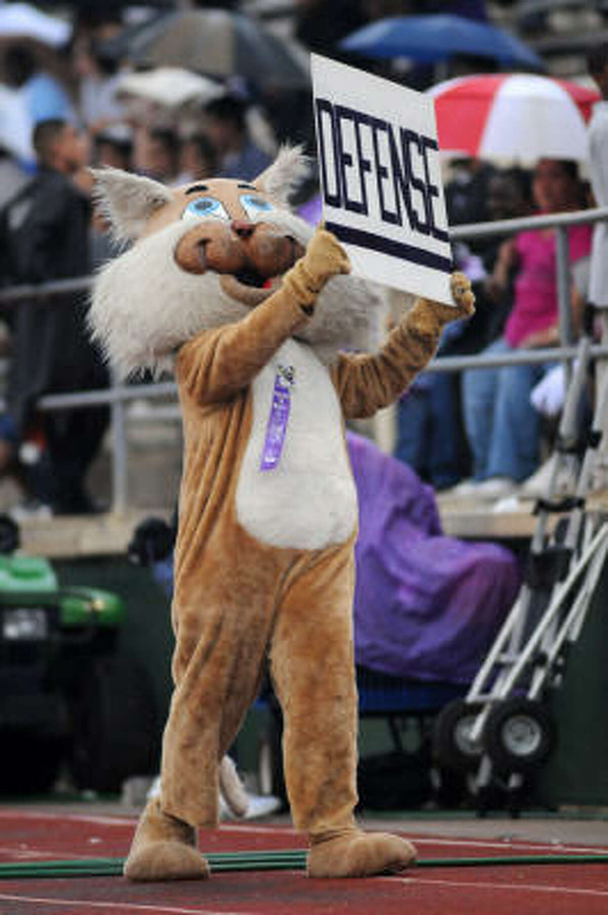 "Willie the Wildcat," who in real life is Trey Legall, calls for defense.