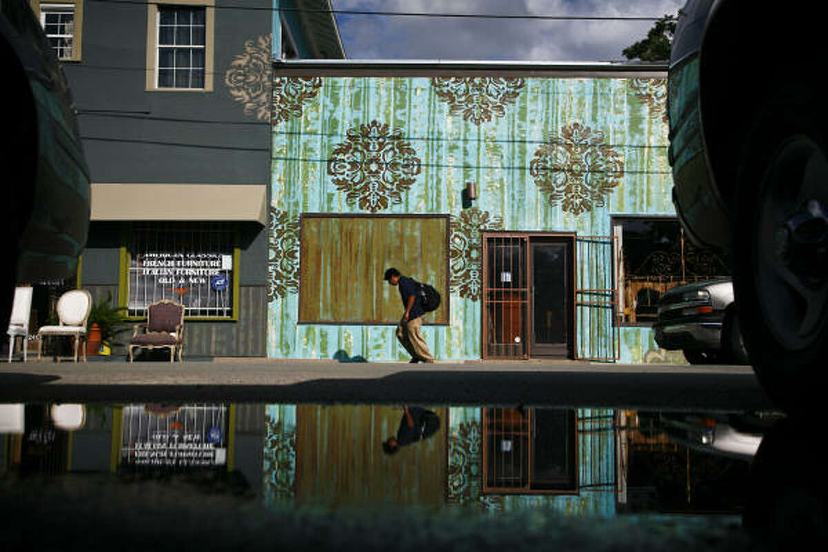 A boy walks near an antique store on the corner of Taft and Fairview in the Montrose area in Houston. The American Planning Association has designated Montrose as one of America's 10 great neighborhoods.