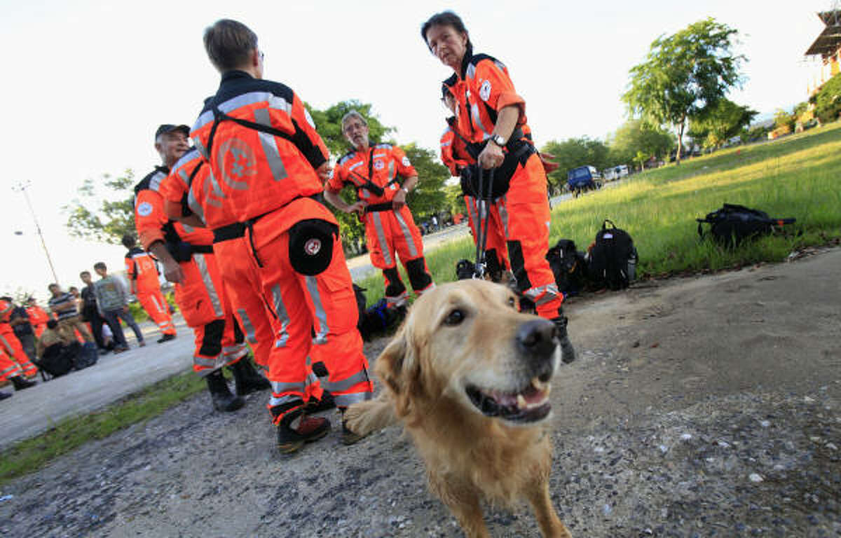 A rescue team with 108 persons and 18 dogs arrive from Switzerland Oct. 2 in Padang, Indonesia. Two days after a 7.6-magnitude quake that toppled thousands of buildings on Sumatra island, stricken residents in a district north of the hard-hit city of Padang, had yet to receive help.