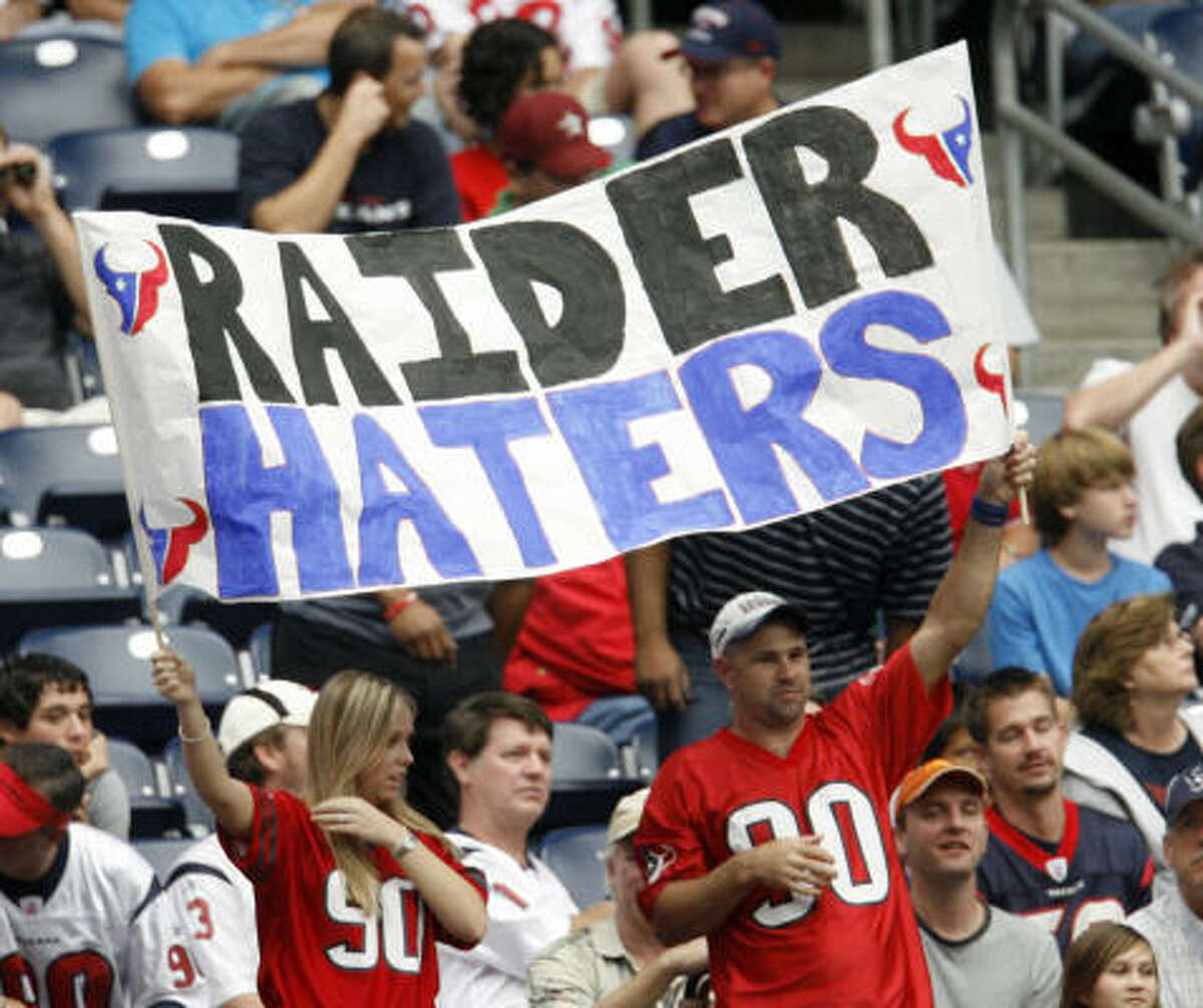 Texans fans hold up a sign that reads "Raider Haters" during the fourth quarter.