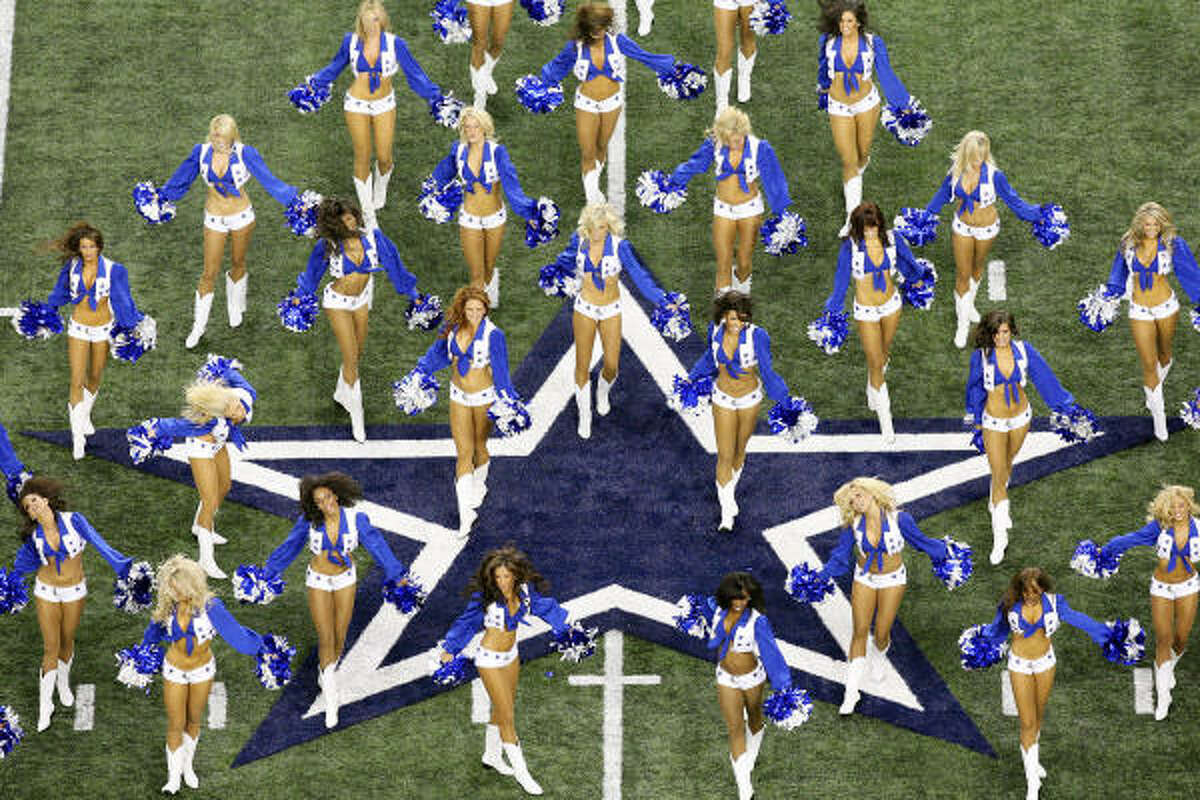 The Dallas Cowboys cheerleaders perform before the game.