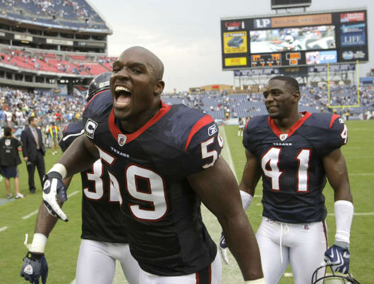 Texans linebacker DeMeco Ryans celebrates the Texans' win over the Tennessee Titans.