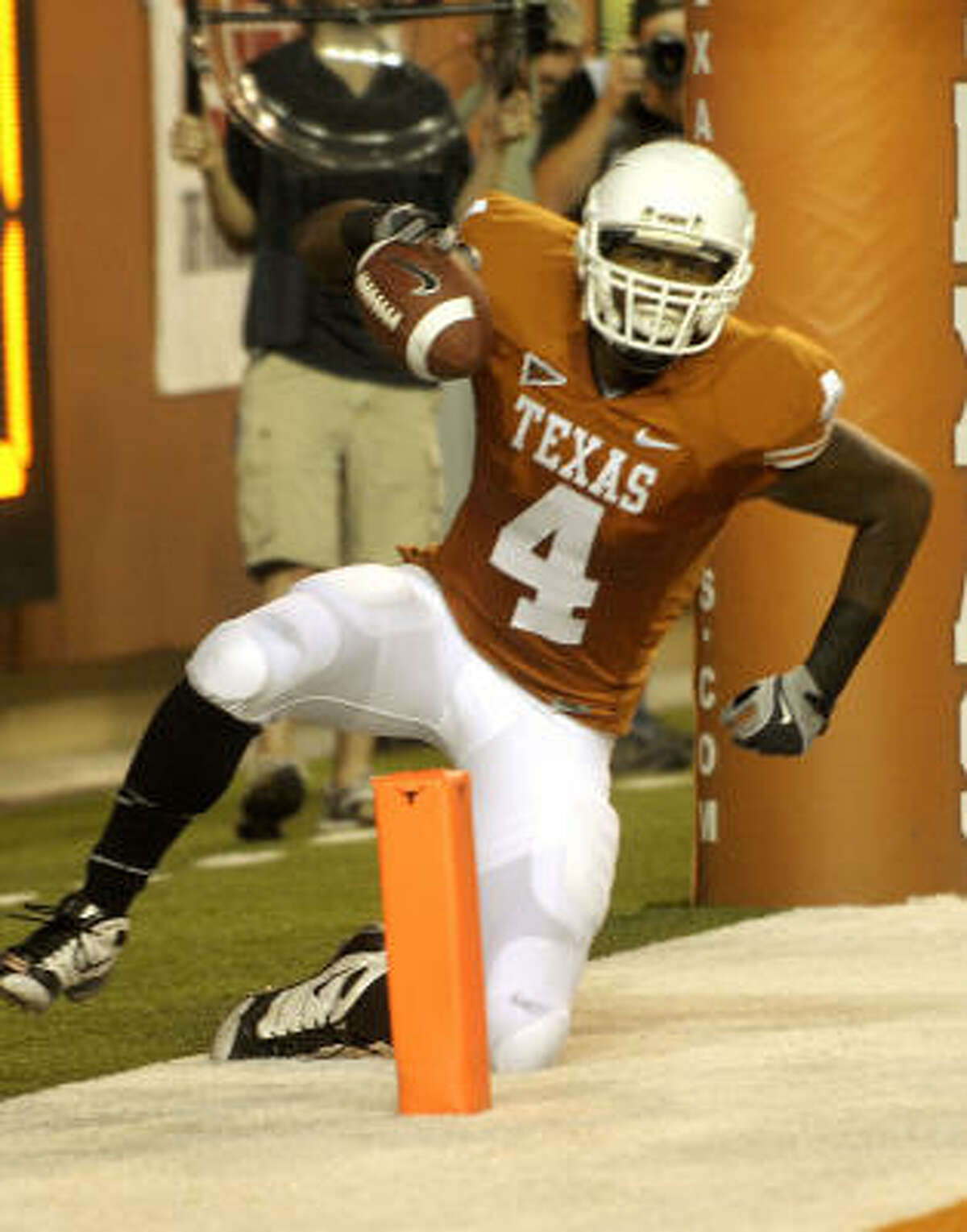 Texas receiver Dan Buckner catches a second-half touchdown pass from Colt McCoy against Texas Tech in Austin on Saturday night.