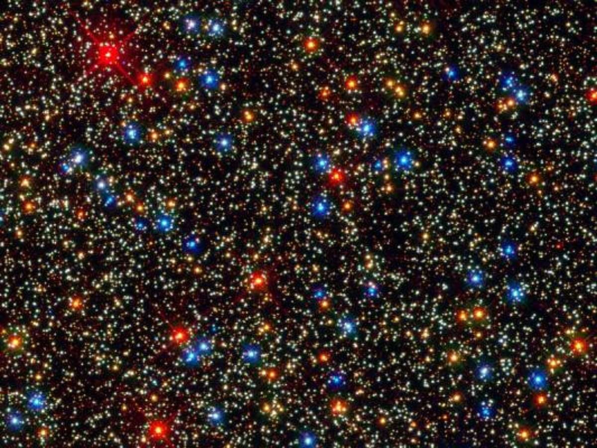 Colorful Stars Galore Inside Globular Star Cluster Omega Centauri - NASA's Hubble Space Telescope snapped this panoramic view of a colorful assortment of 100,000 stars residing in the crowded core of a giant star cluster. The image reveals a small region inside the massive globular cluster Omega Centauri, which boasts nearly 10 million stars. Globular clusters, ancient swarms of stars united by gravity, are the homesteaders of our Milky Way galaxy. The stars in Omega Centauri are between 10 billion and 12 billion years old. The cluster lies about 16,000 light-years from Earth.