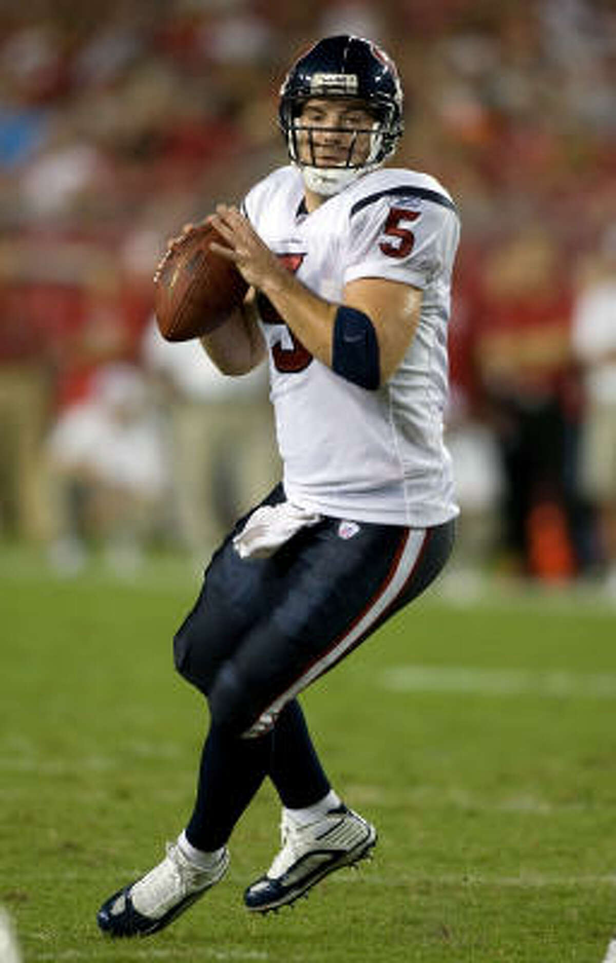 Texans quarterback Rex Grossman looks for an open receiver.