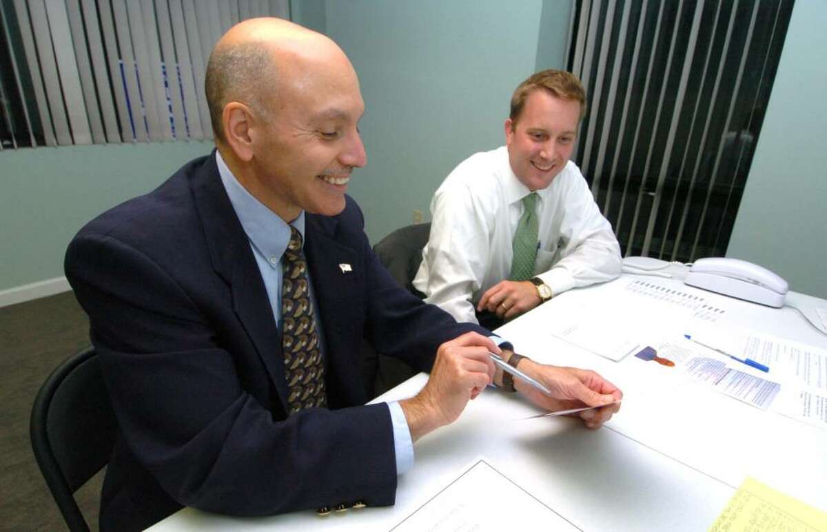 From left, Gary Goncalves and Ryan Reynolds work on the democratic campaign for mayor of Danbury, Wednesday, Oct. 7, 2009.