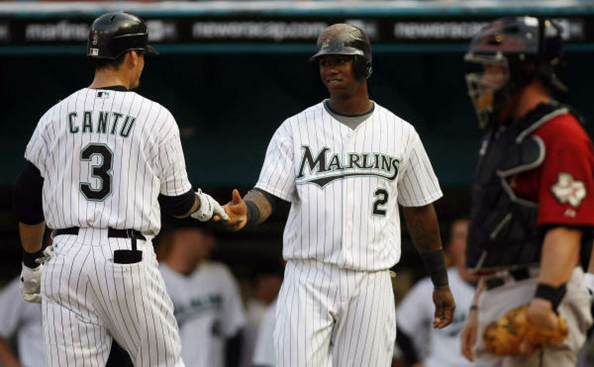 Marlins first baseman Jorge Cantu is congratulated by teammate Hanley Ramirez after hitting a two-run homer in the first inning.