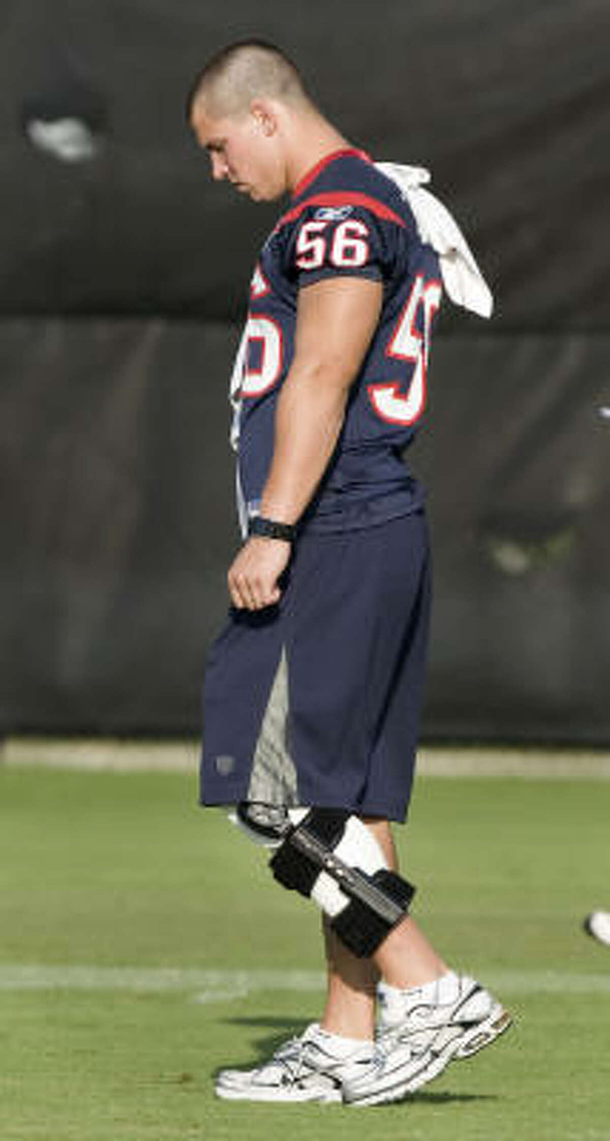 Linebacker Brian Cushing is forced to wear a knee brace after suffering a sprained left knee one day earlier.