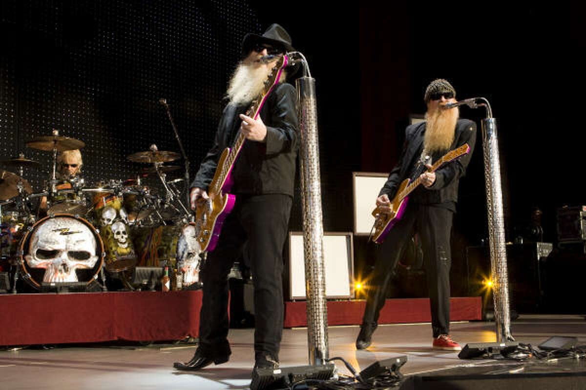 ZZ Top's Dusty Hill, left, and Billy F. Gibbons and Frank Beard, on drums, perform during their concert at the Cynthia Woods Mitchell Pavilion. Read the review here.