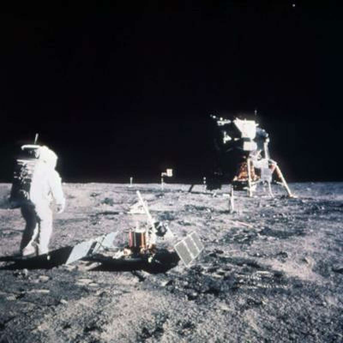 Astronaut Edwin E. Aldrin Jr., lunar module pilot, stands on the lunar surface after the Apollo 11 moon landing on July 20, 1969. The Lunar Module is seen in the background.