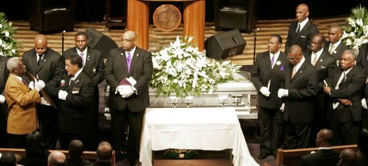 Members of the Omega Psi Phi fraternity take part in a memorial service for Steve McNair.