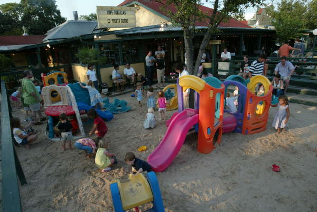 Lupe Tortilla's has a huge playground for kids to play on while waiting for a table. There are several location in and around Houston.