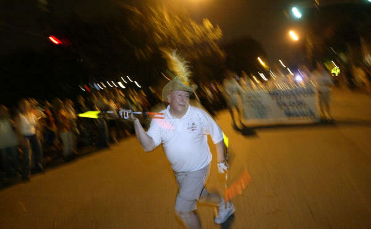 A baton-twirler leads the Houston Pride Band down Westheimer in 2007.