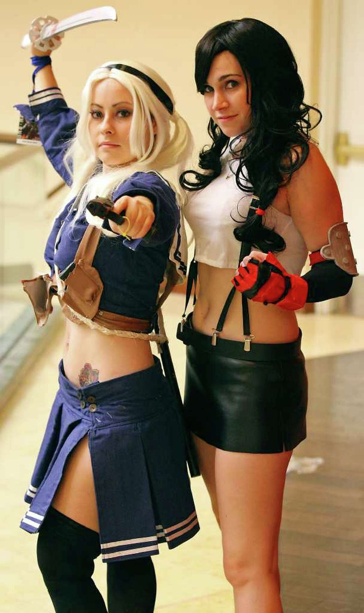 Ecaterina Perez, 26, as "Babydoll" (left) and Laura Gladney as "Tifa Lockhart" pose for a photo while attending the San Japan 4TW convention Saturday Aug. 6, 2011 at the Marriott Rivercenter.