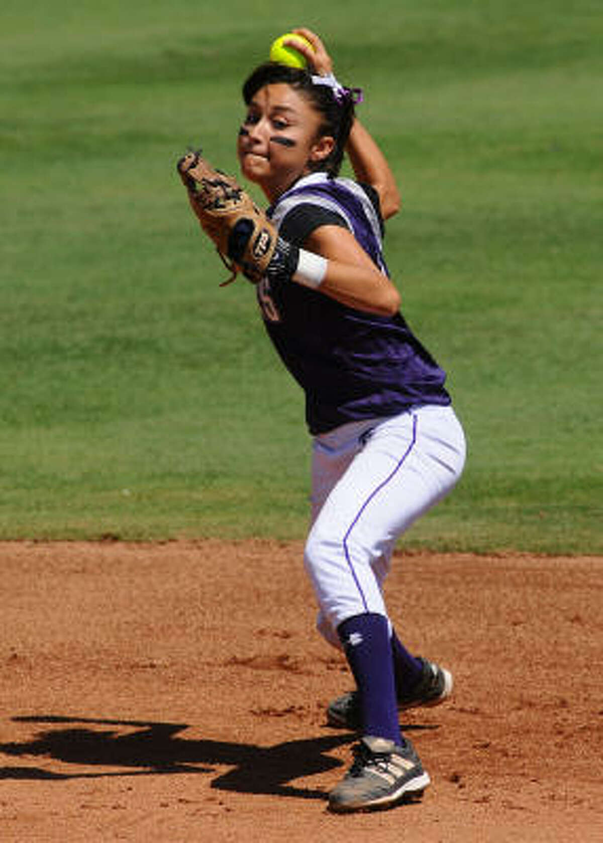 Gabby Banda delivers a throw to first base for the out during the 1-0 win over Azle.