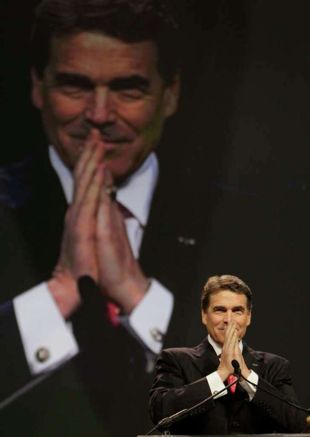 Texas Governor Rick Perry read scripture and gave a prayer during The Response: A Call To Prayer for a Nation in Crisis event at Reliant Stadium Saturday, Aug. 6, 2011, in Houston. The seven hour program of prayer and fasting in Reliant Stadium was initiated by Texas Governor Rick Perry and funded by the American Family Association. ( Melissa Phillip / Houston Chronicle )