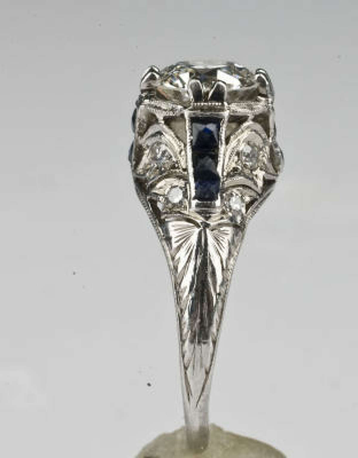 Love the detailing on the band of this platinum Art Deco diamond ring with sapphires, $12,500, Past Era Fine Antique & Estate Jewelry