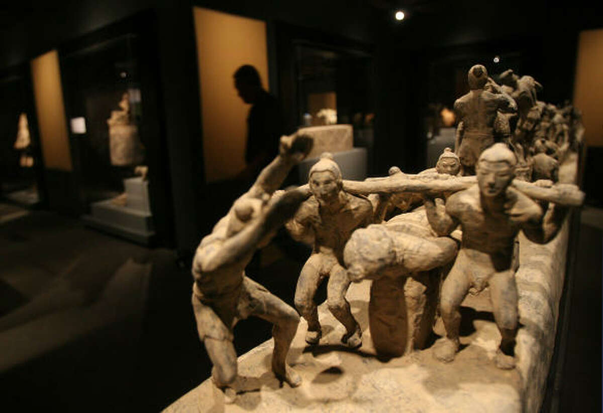 An exhibit of terra cotta warriors from Xiyang Village, China, is prepared at the Houston Museum of Natural Science. The statues have been on display in Houston since May 22 and were fashioned in about 221 B.C.