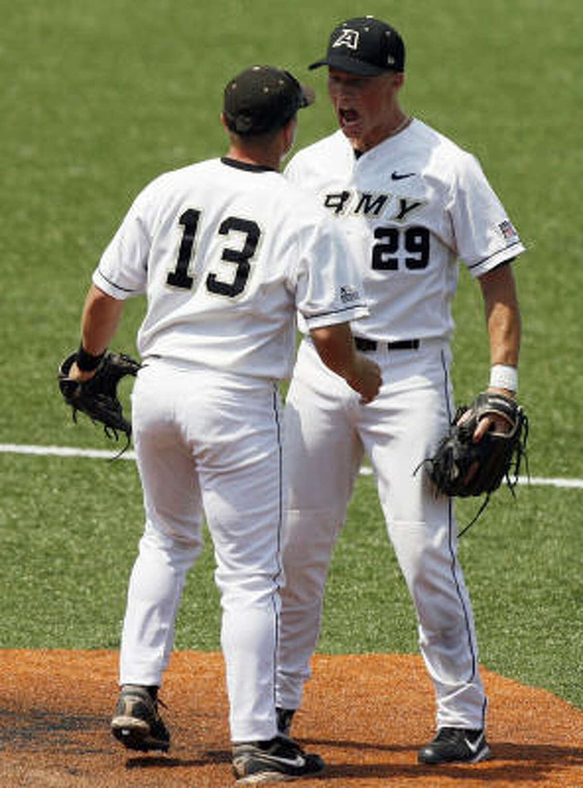 Army's Clint Moore, right, and Tony Capozzi celebrate after beating Texas State 7-4.