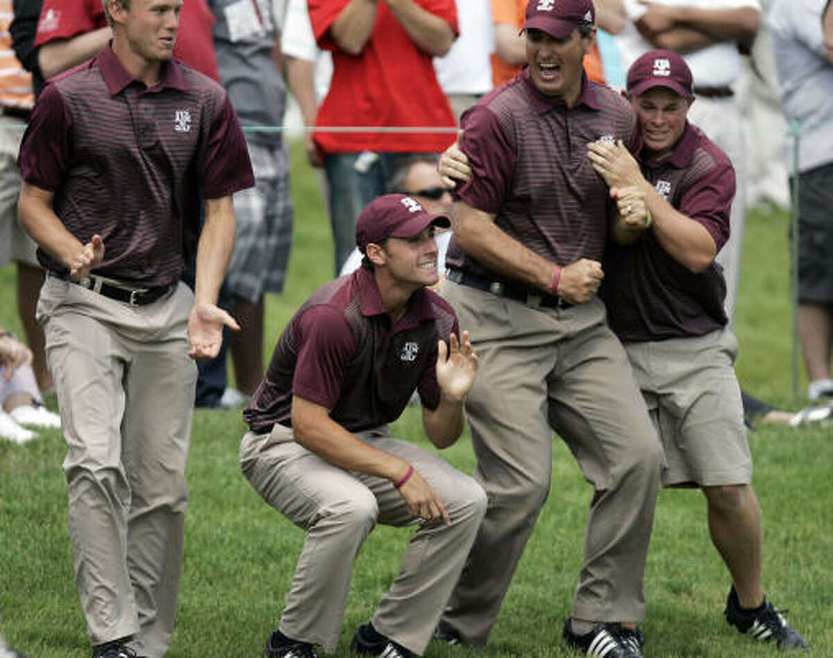 Members of the Texas A&M's golf team celebrate near the 18th green. It marks the Aggies' first team title since the women's softball team in 1987.