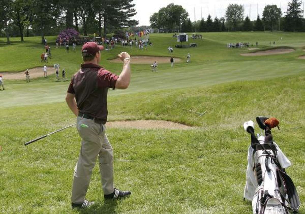 Texas A&M's Bronson Burgoon celebrates after hitting his scond shot on the 18th hole, Saturday, May 30, 2009, during the NCAA Division I Men's Golf Championship at the Inverness Club in Toledo, Ohio.