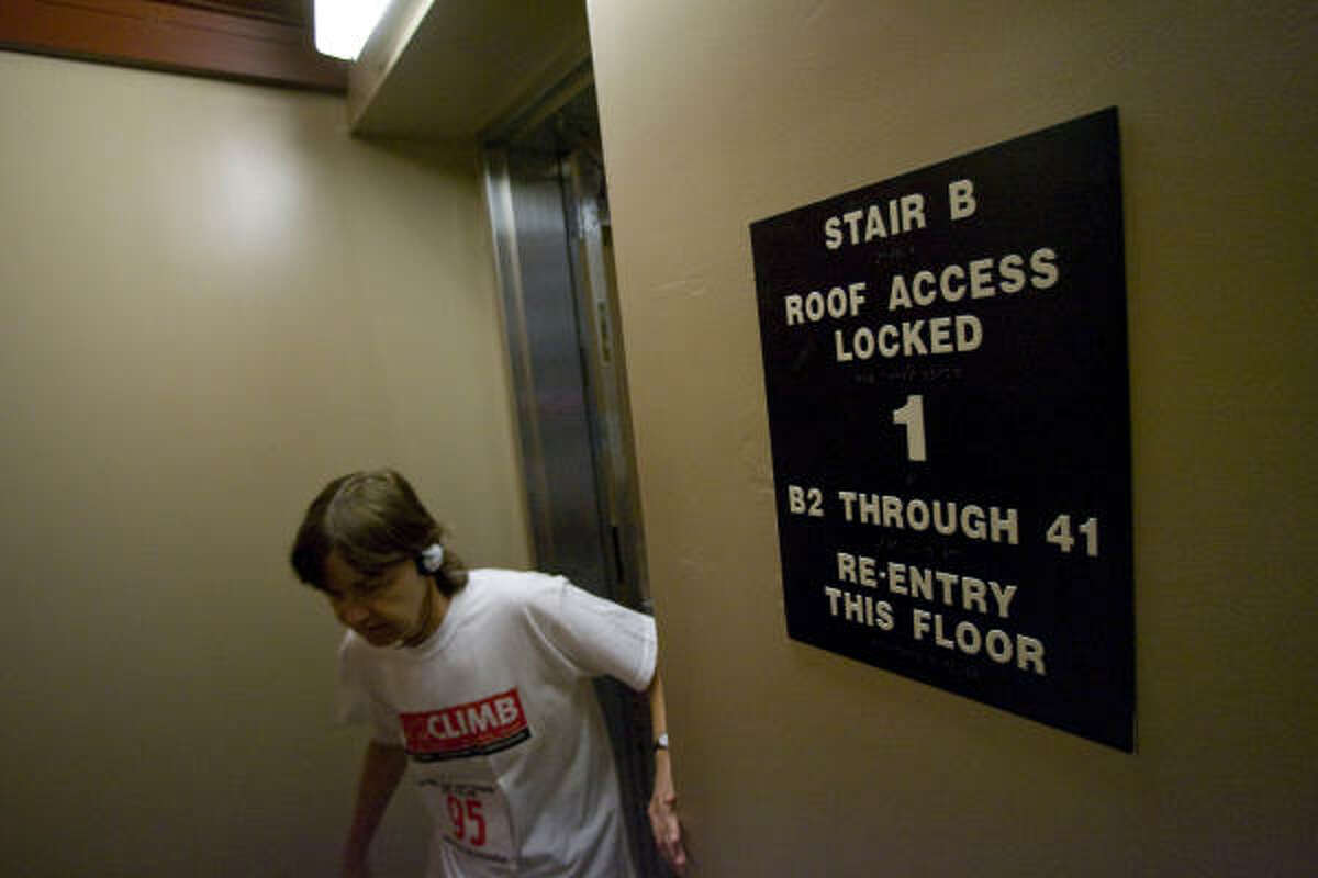 Renate Wiseman makes her way up the stairwell on the first floor of the Marathon Oil Tower as about 250 competed in the Fight for Air Climb benefiting the American Lung Association.