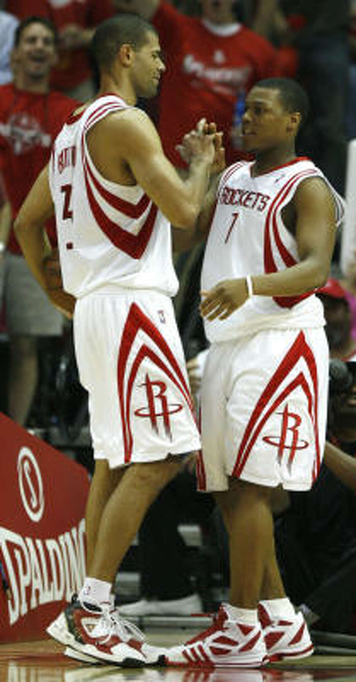 Rockets forward Shane Battier (31) and Rockets guard Kyle Lowry (7) high five after Lowry scored during the fourth.