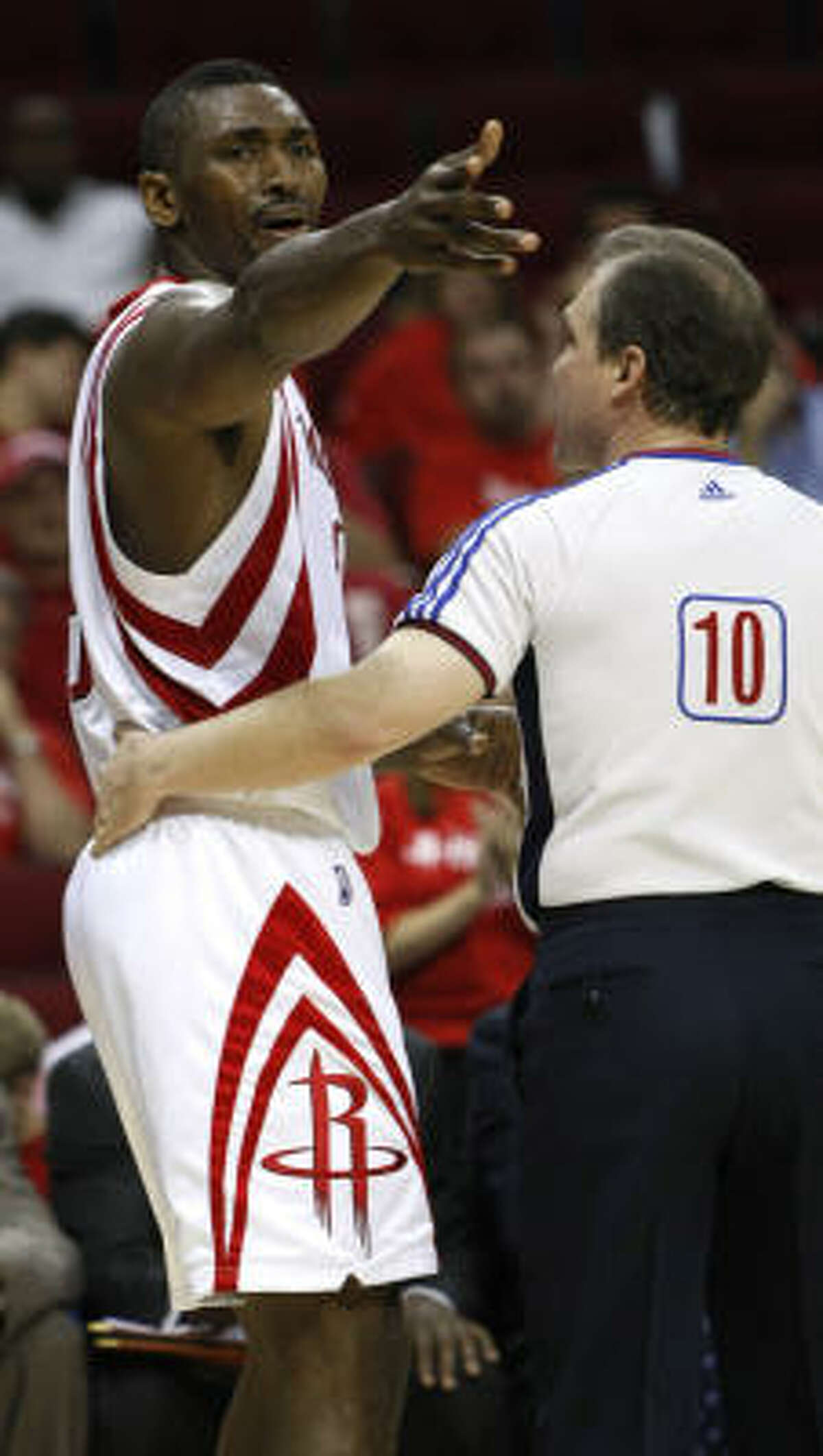 Ron Artest argues his ejection from the game with official Ron Garretson during the fourth quarter.