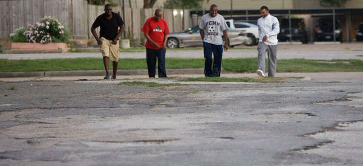 Michelo Kalambo, Brian Mbuu, Chilobe Kalambo, and Chijioke Asomugha canvas a neighborhood in southwest Houston looking for people who might be homeless as they volunteer with Search.