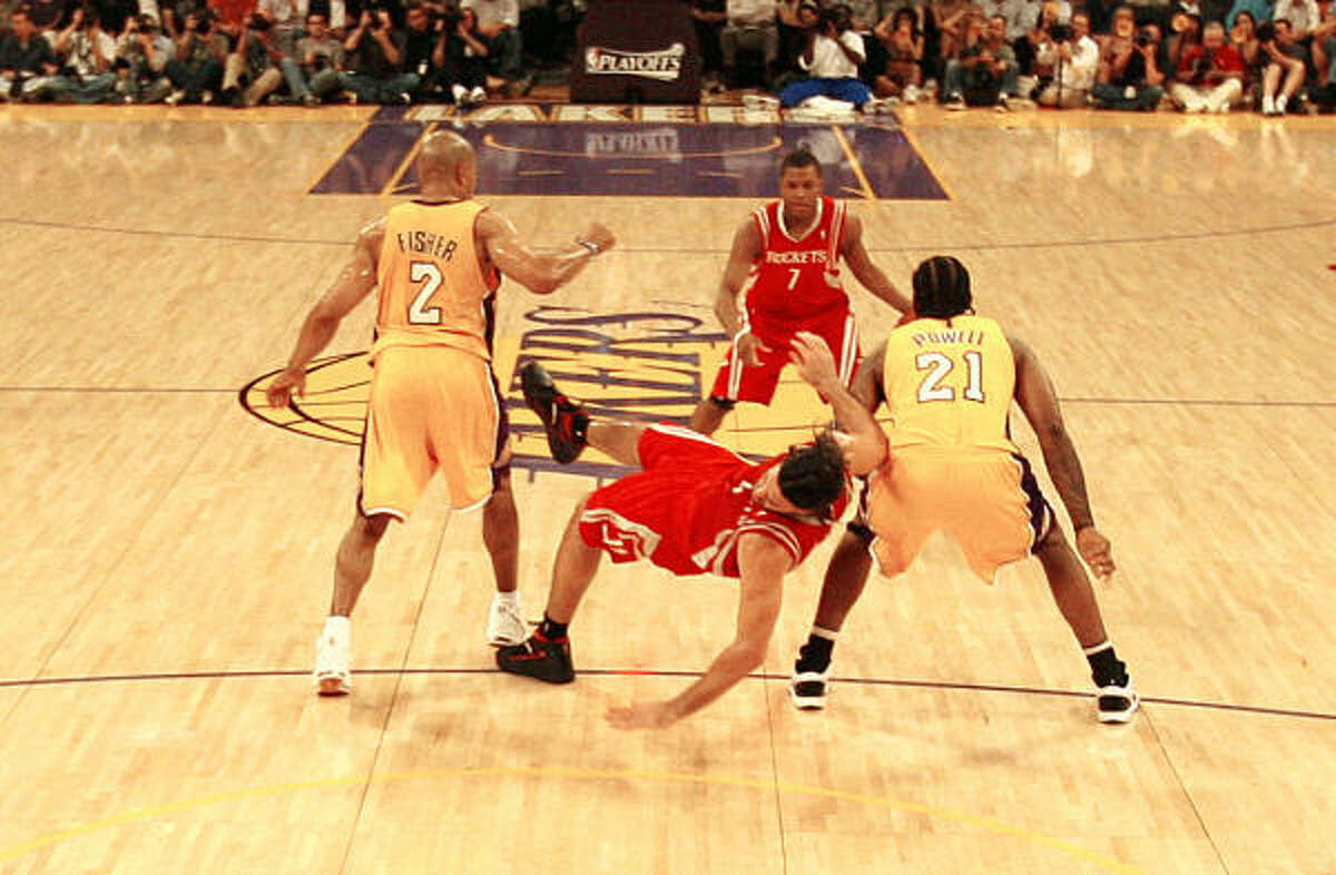 Los Angeles Lakers guard Derek Fisher (2), left, is called for the hard foul on Luis Scola that earned Fisher a one-game suspension.