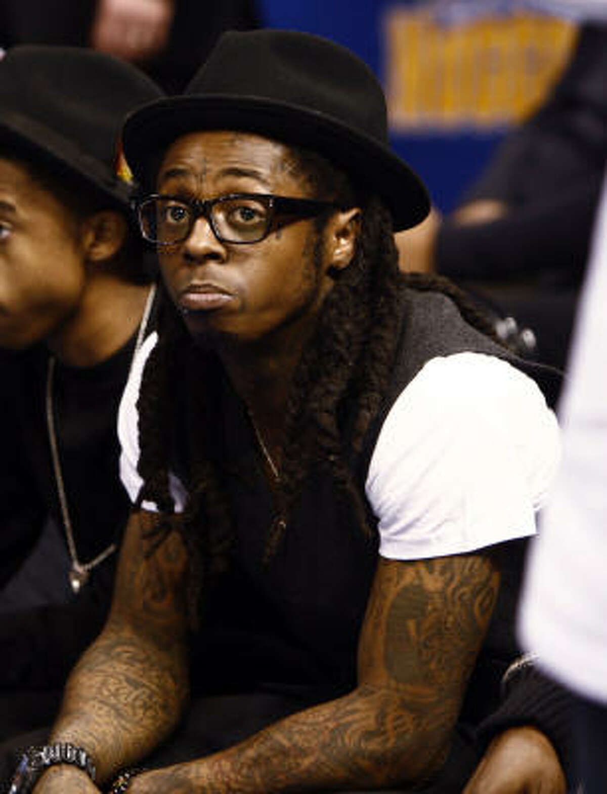 Now we see Lil' Wayne still with his watch, but looking a little more humble.