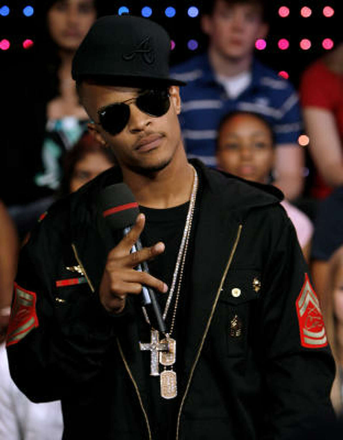 T.I. was all flash with his chains and aviator sunglasses.