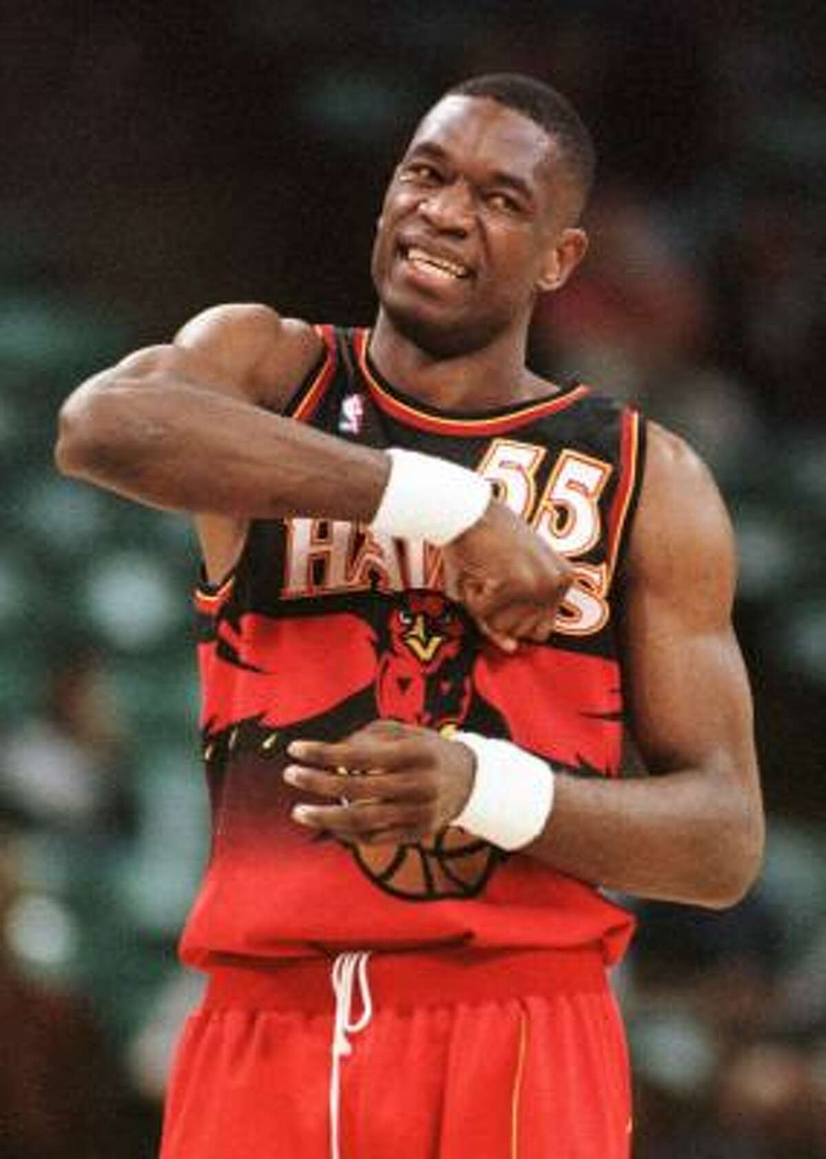 Never too humble on the court, Mutombo mocks driving a dagger into his heart in the closing moments of a Hawks win in 1998.