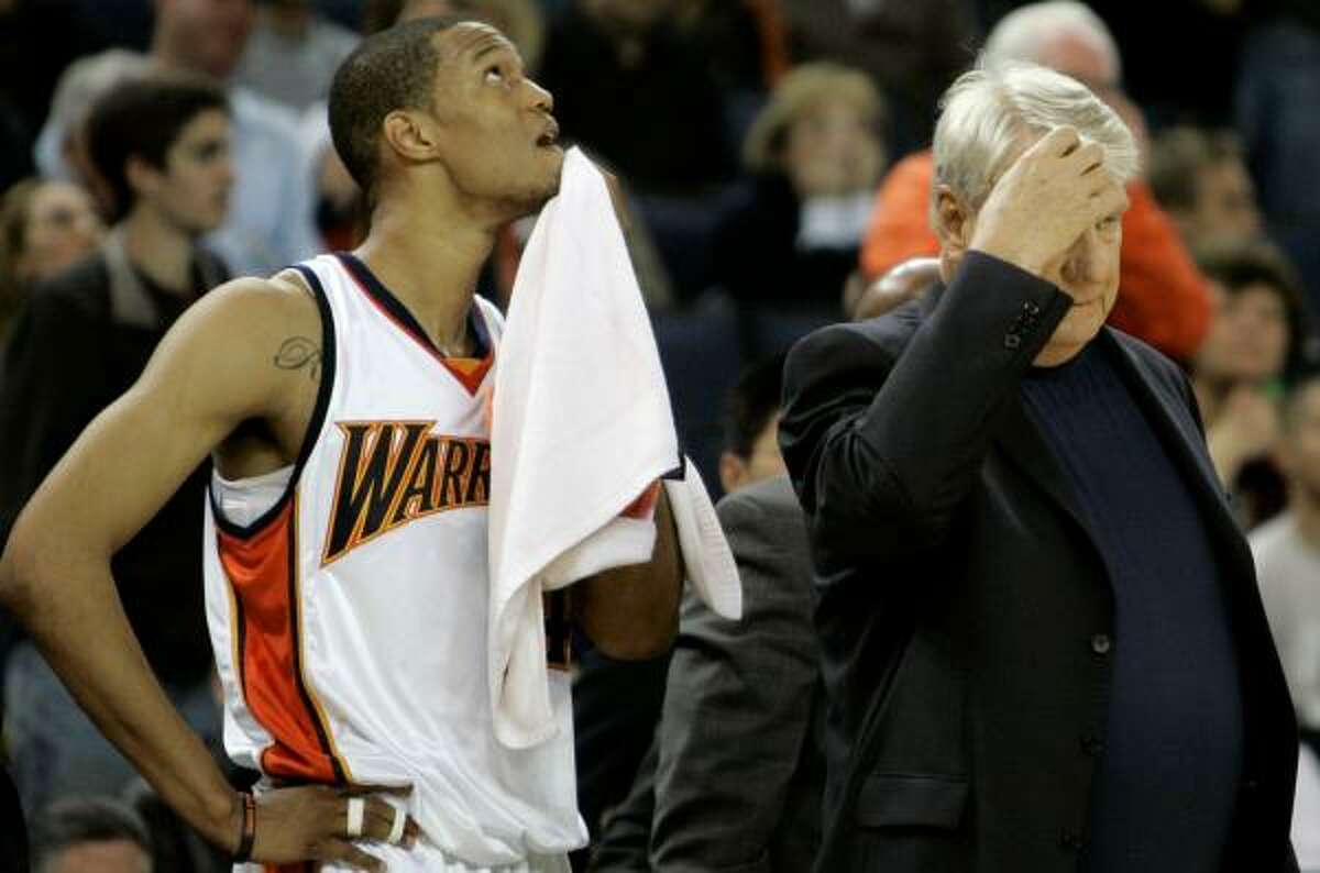 Golden State Warriors' Anthony Randolph, left, and head coach Don Nelson stand on the sidelines in the fourth quarter.