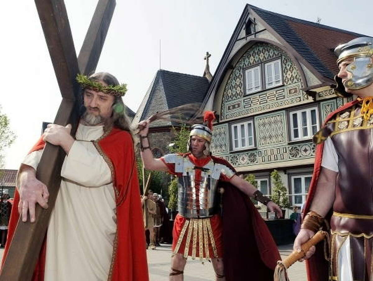 Hartmuth Lux in the role of Jesus and other lay actors perform the Stations of the Cross during the Good Friday procession on April 10, 2009 in Bensheim, western Germany. Thousands of believers flocked the roads of the village to attend the passion play.