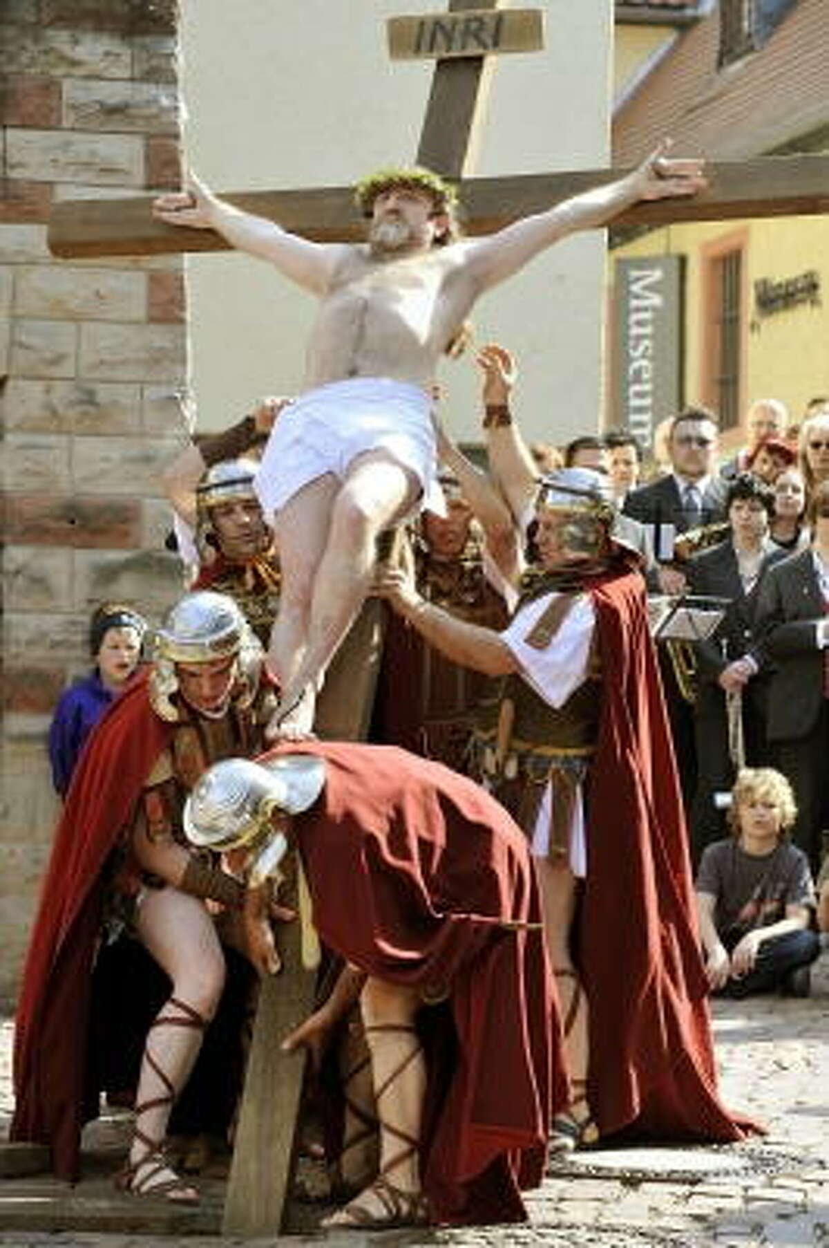 Hartmuth Lux in the role of Jesus and other lay actors perform the Stations of the Cross during the Good Friday procession on April 10, 2009 in Bensheim in western Germany. Thousands of believers flocked the roads of the village to attend the passion play.