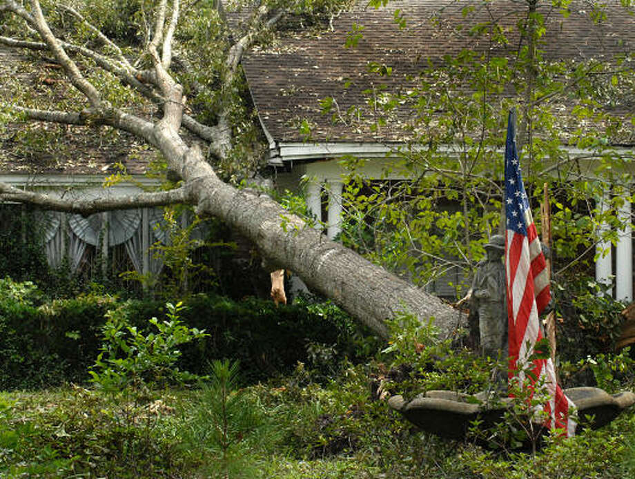 An American flag still waves at a house on Shady Oaks Dr. in North Conroe. Photo: David Hopper, For The Chronicle