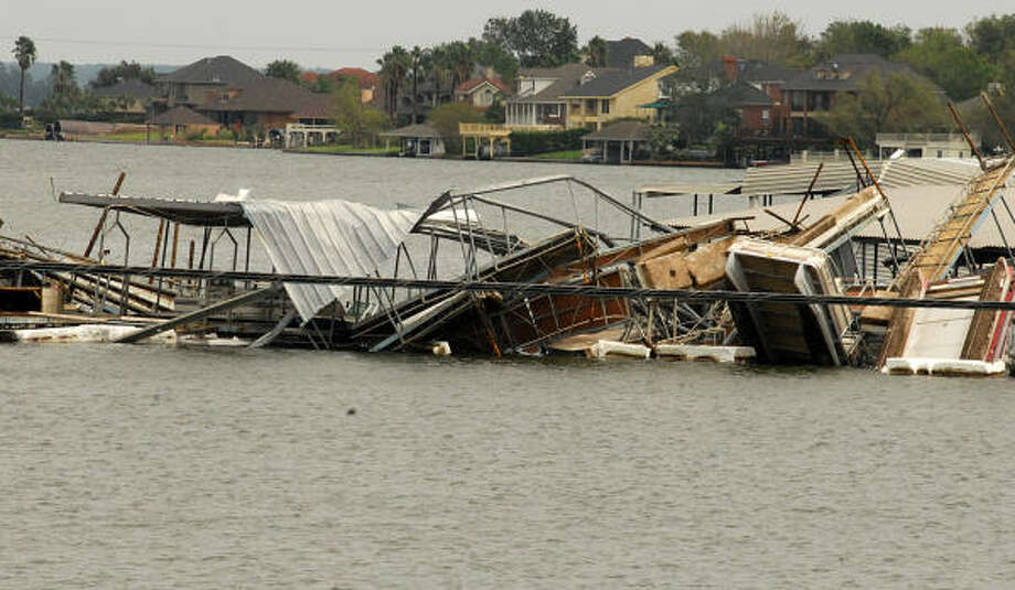 April Plaza Marina, 17742 Hwy 105 Wes, on Lake Conroe, suffered significant damage when a boat dock flipped over and landed on top of another boat dock at the Marina. Photo: David Hopper, For The Chronicle