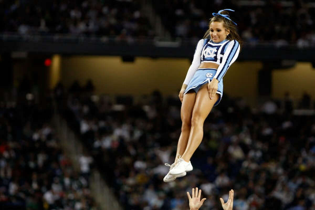 A North Carolina Tar Heels cheerleader gets thrown in the air.