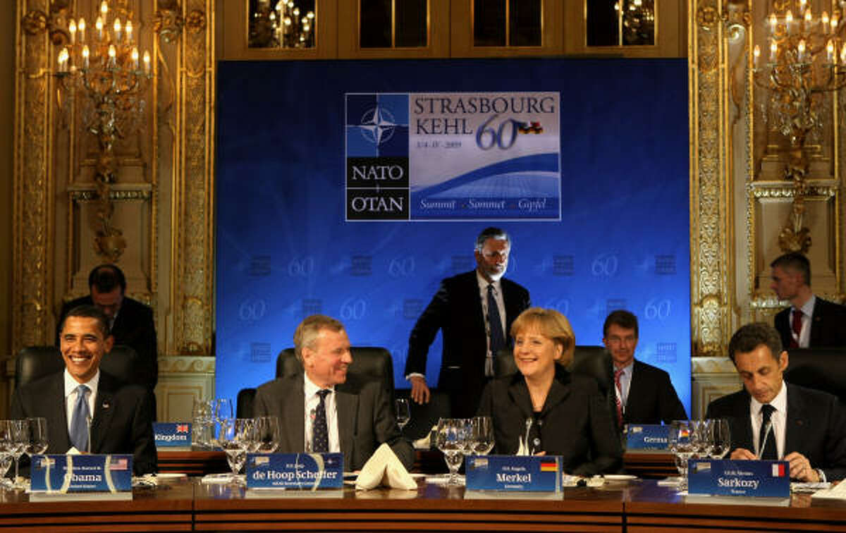President Obama enjoys a working dinner with NATO Secretary-General Jaap de Hoop Scheffer, second from left, German Chancellor Angela Merkel and French President Nicolas Sarkozy in Baden-Baden, Germany, on April 3.