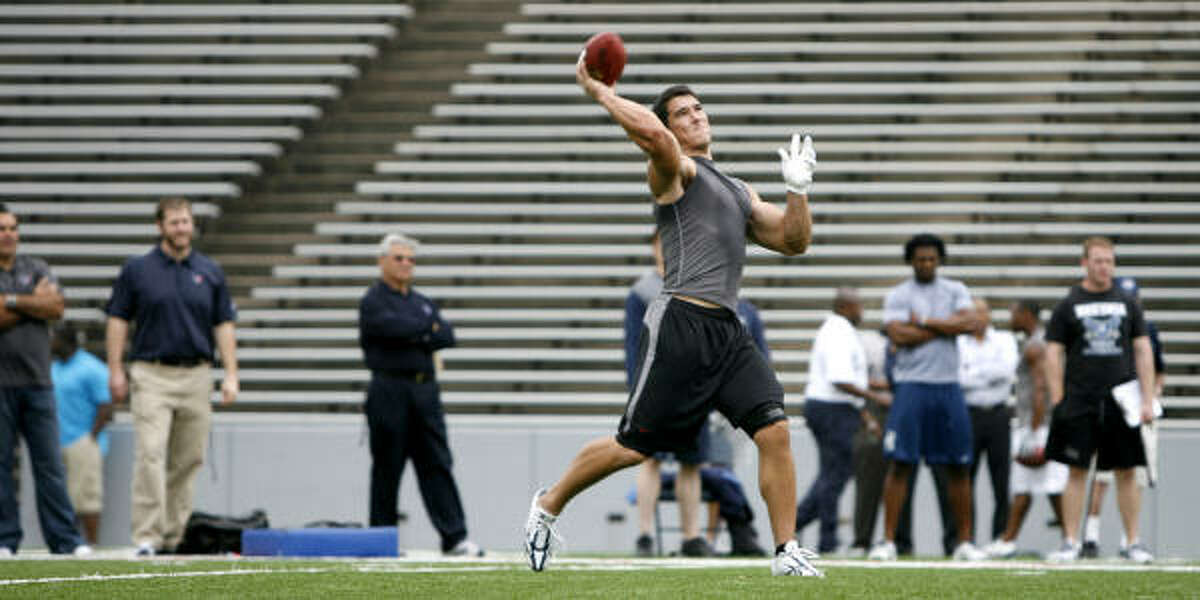 Rice's James Casey throws the football during drills for scouts at Rice Stadium.