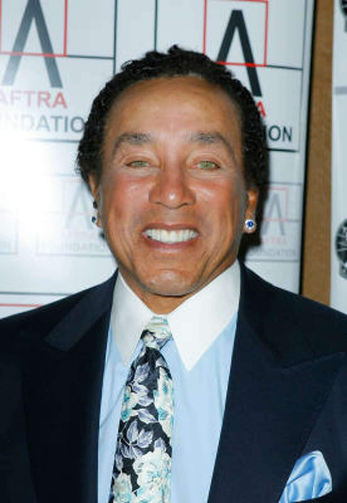 Singer Smokey Robinson was one of the earliest African-American sex symbols when his Motown-sound band, The Miracles, rose to stardom in the 1960s.