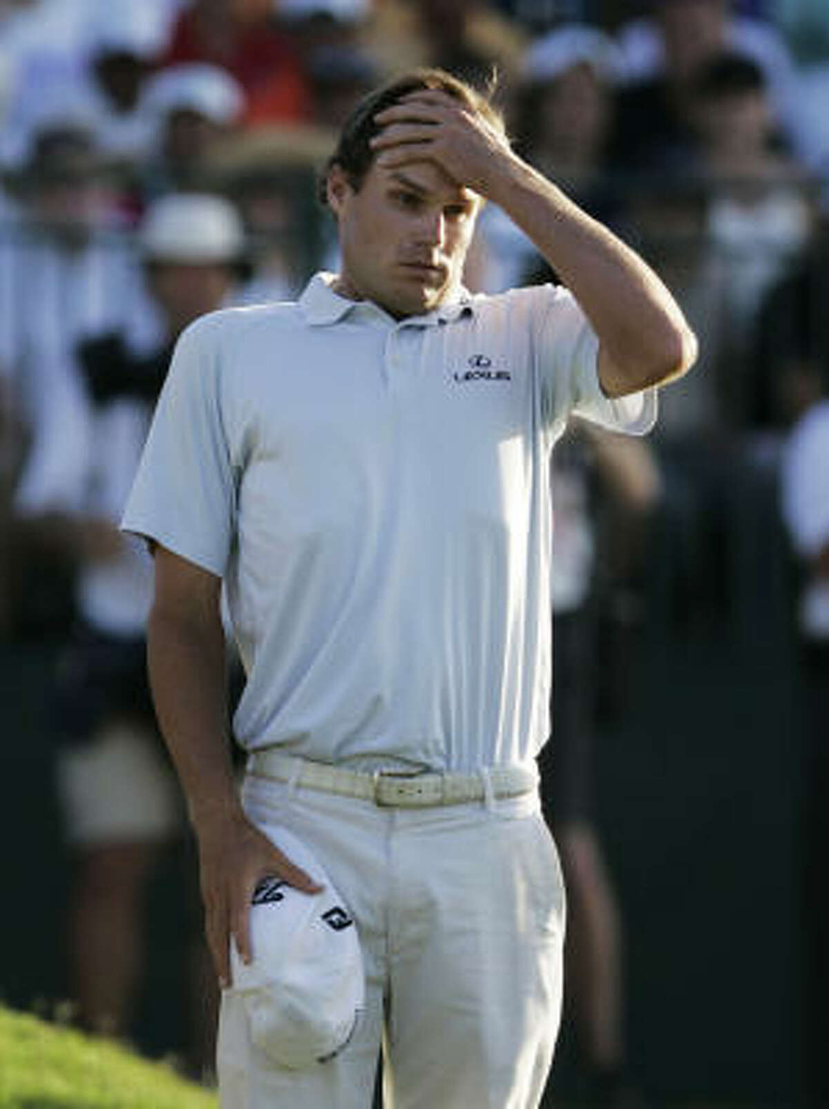 Nick Watney reacts after missing a putt on the 18th hole to finish in second place behind Phil Mickelson.