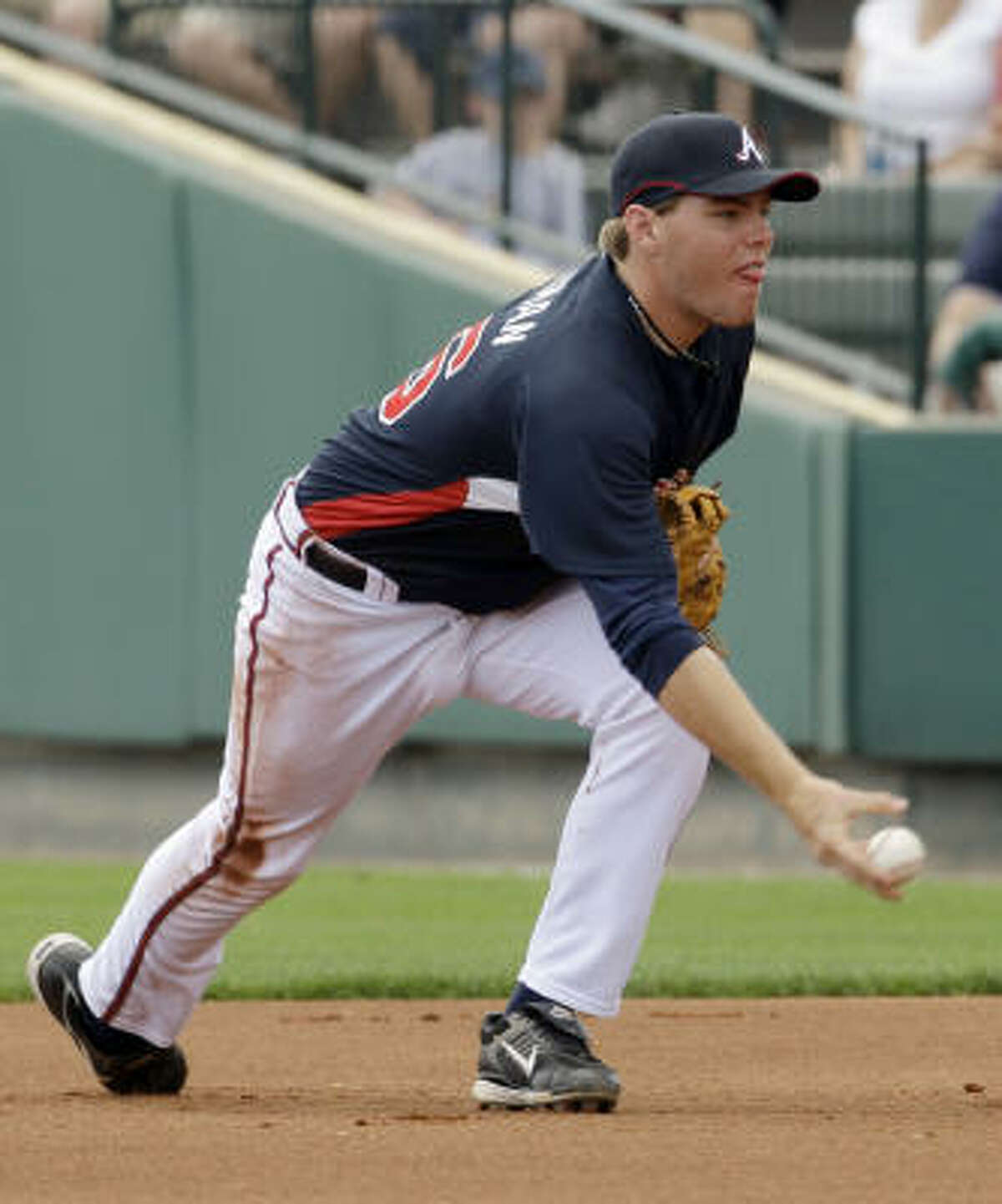 Atlanta Braves first baseman Freddie Freeman flips the ball to the bag to force out Astros first baseman Lance Berkman to end the first inning.