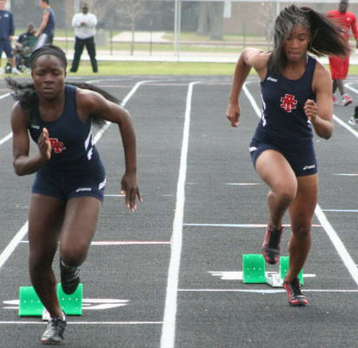 (From left) Alief Taylor's Morgan Pressley and Briana Jarrett take off in this race.
