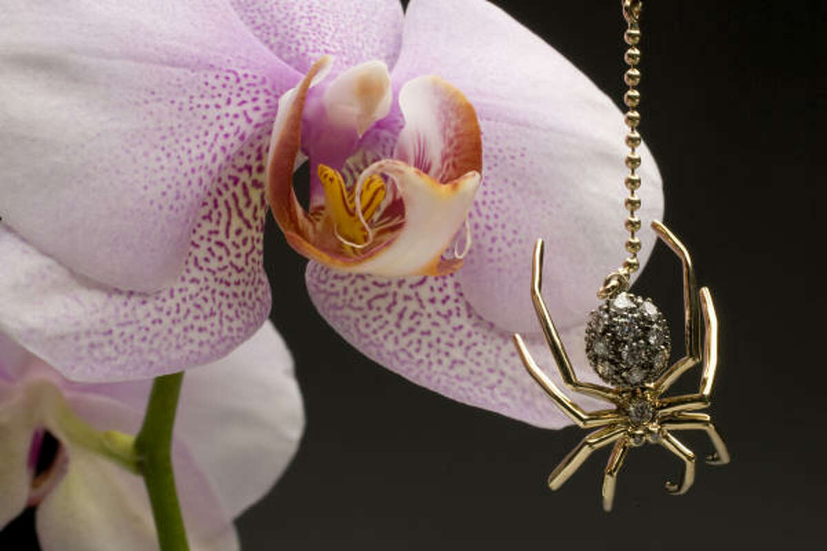 Oh, what a beautiful web it'll weave. Jennifer Herwitt’s 14-karat gold and diamond spider dangles from a chain of tiny beads. $3,300, Sloan/Hall.