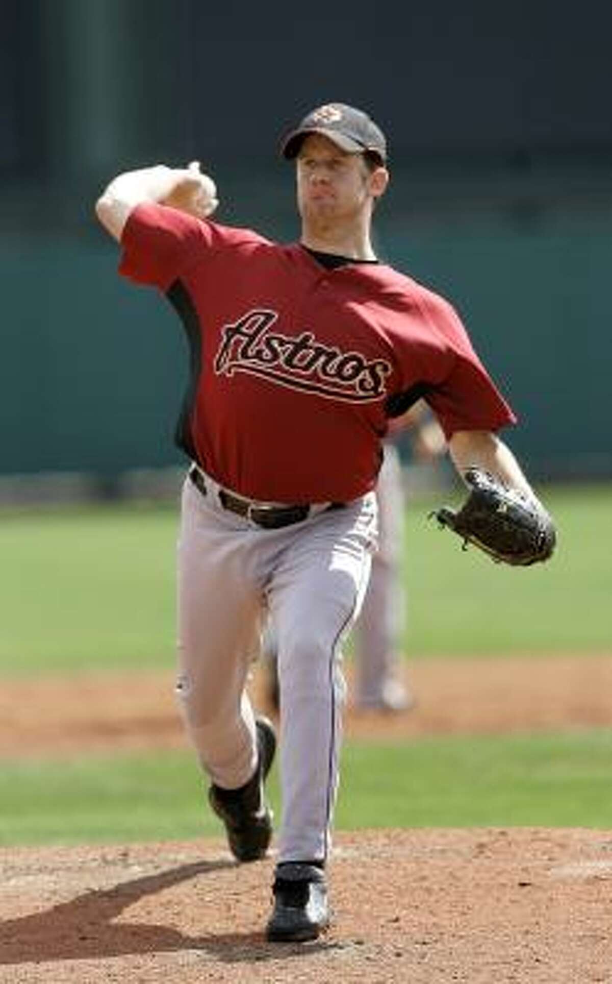 Roy Oswalt won't pitch again for the Astros until after the World Baseball Classic.