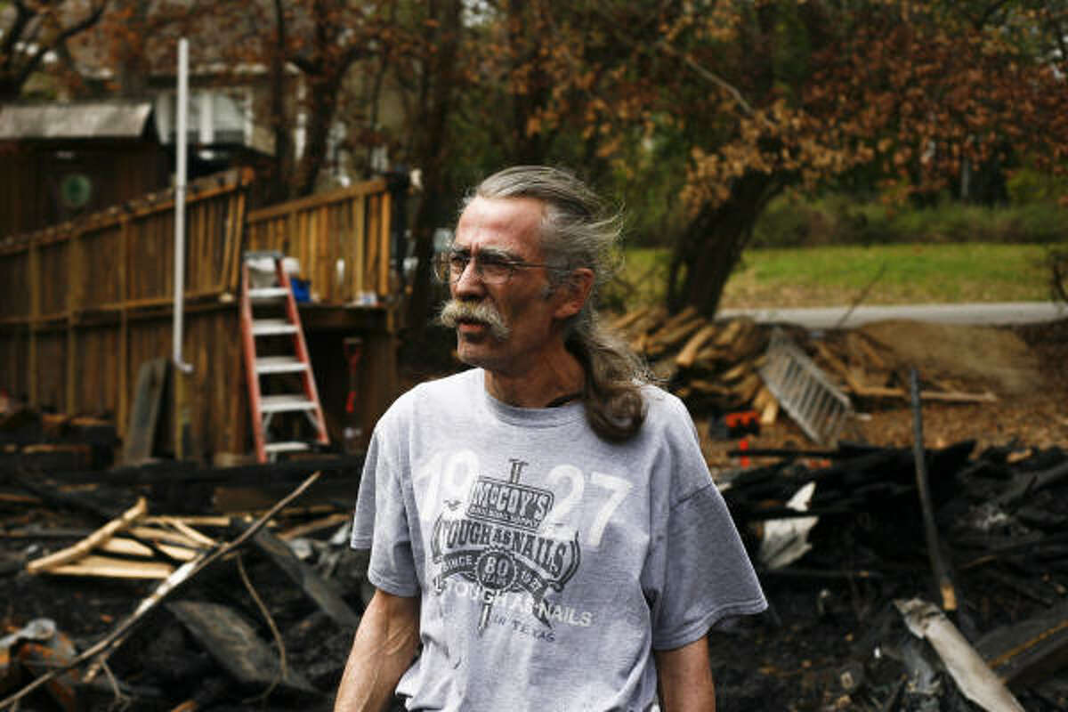 Dan Phillips stands amidst the rubble. Phillips' organization, The Phoenix Commotion, is based off the mythical Phoenix who rose from the ash.